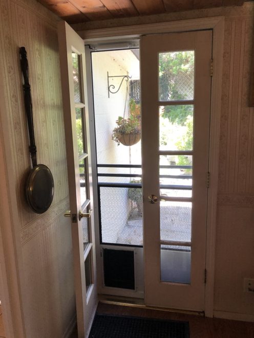 Custom Made Medium Pet Door on the Side of a Tahoe Screen Door in Woodland Hills